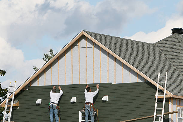 Professional Siding technician working in Highland, MD